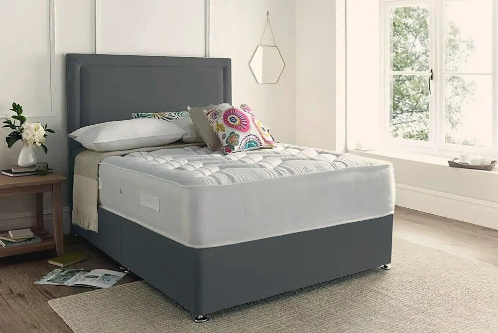 A dark divan bed with a headboard