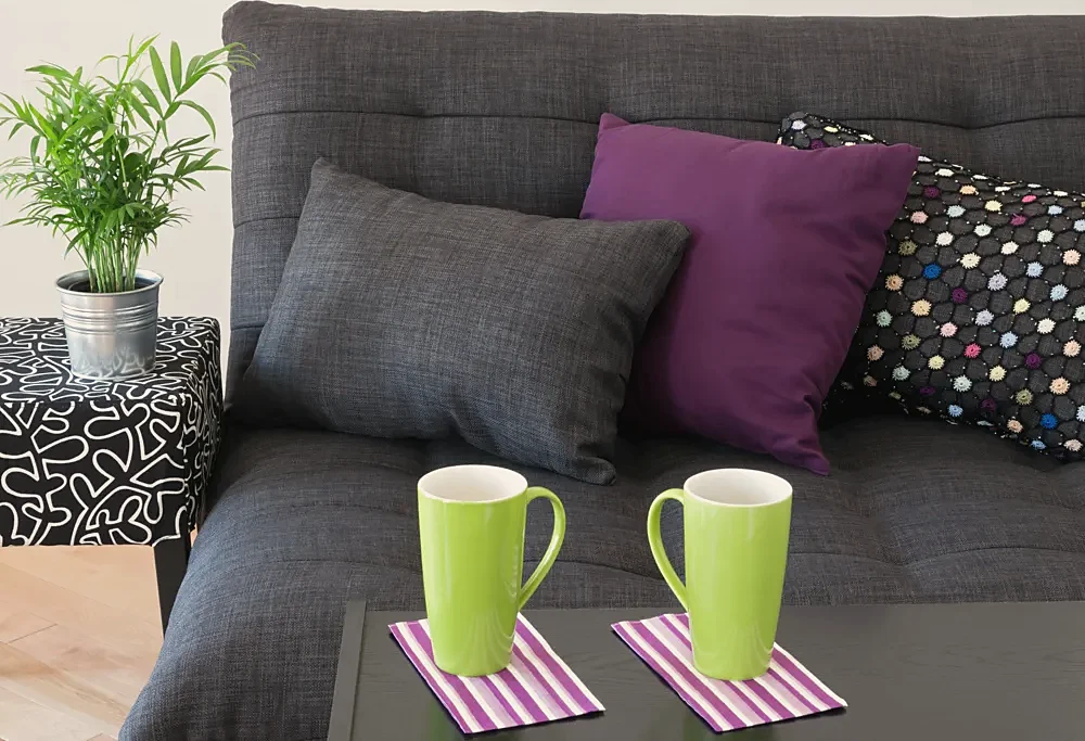 A sofa with bright cushions